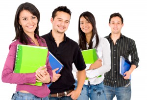Casual group of college students smiling - isolated over a white background
